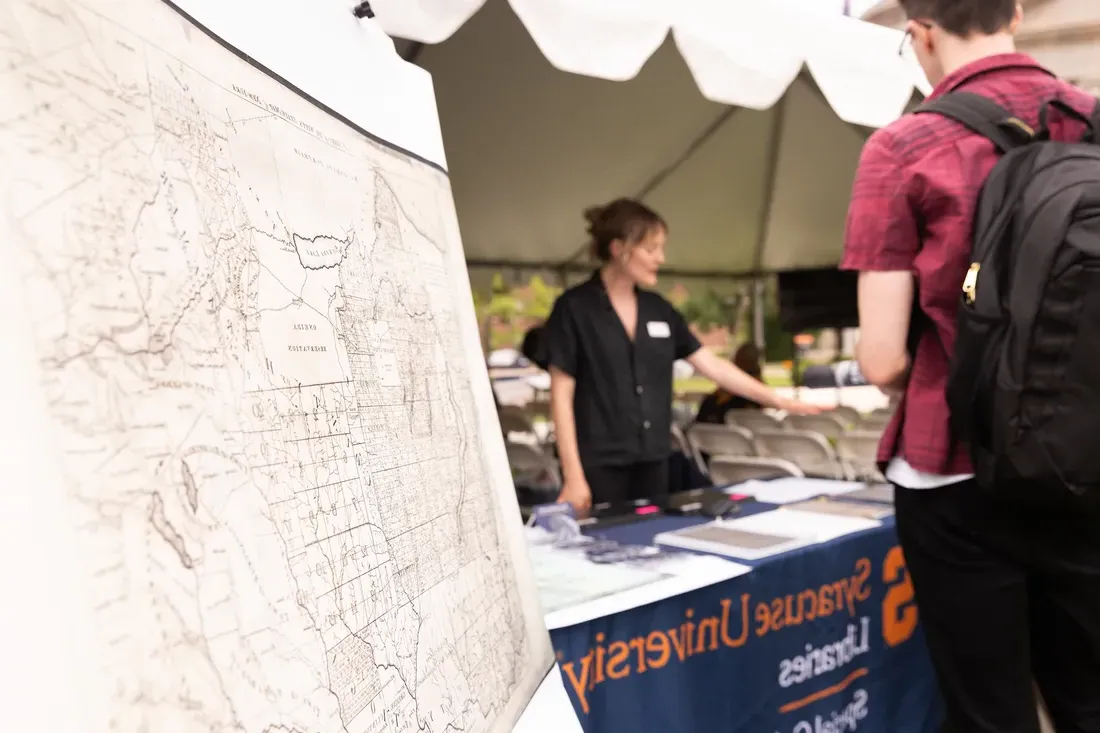 Indigenous land map on display at a booth.